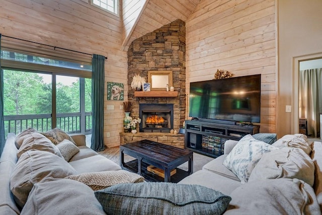 43 Morley Dr, Ellijay, GA 30540 - living room with high vaulted ceiling, a stone fireplace, wood walls, and wood finished floors