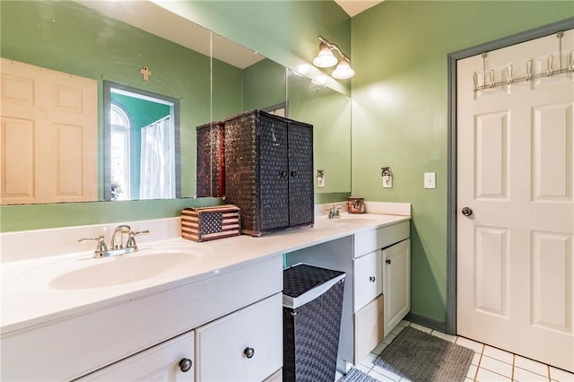 bathroom with tile patterned flooring, vanity, and walk in shower