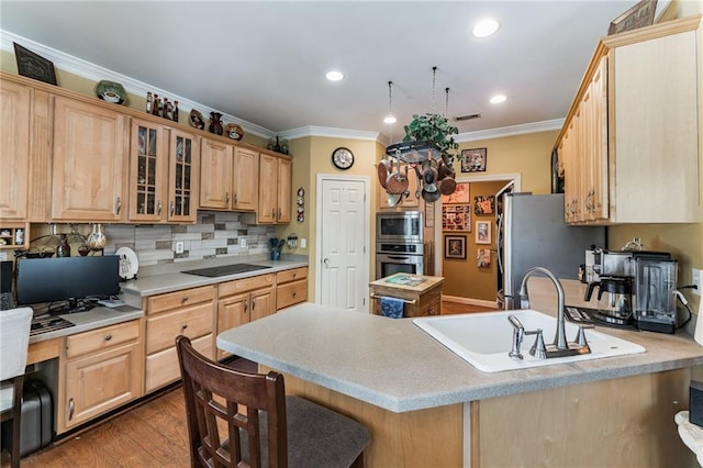 kitchen featuring ornamental molding, kitchen peninsula, decorative backsplash, appliances with stainless steel finishes, and hardwood / wood-style flooring