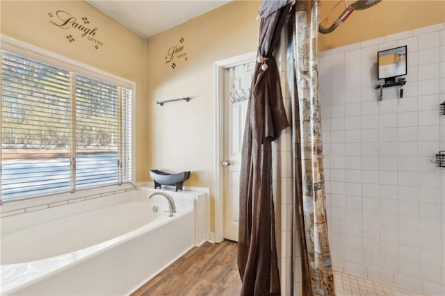 bathroom with plus walk in shower and wood-type flooring