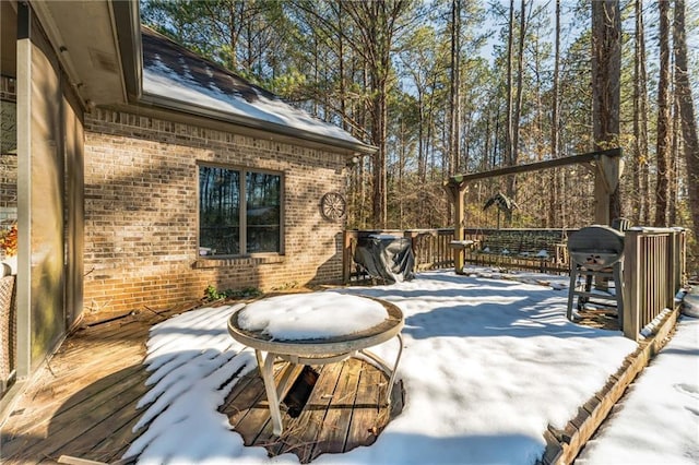 view of snow covered deck