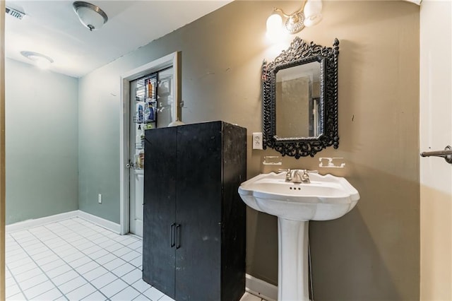 bathroom featuring tile patterned floors and sink