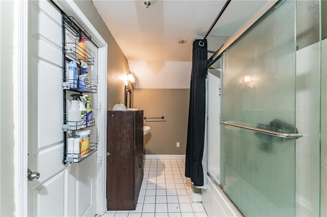 bathroom with tile patterned floors, lofted ceiling, and bath / shower combo with glass door