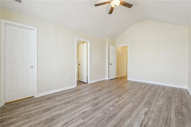 unfurnished bedroom featuring ceiling fan, lofted ceiling, and light hardwood / wood-style flooring