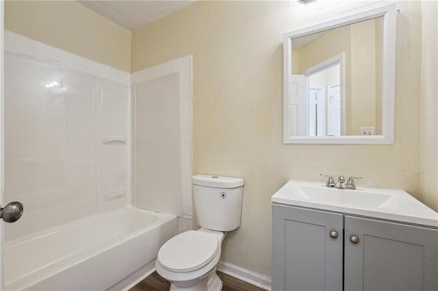 full bathroom with toilet, vanity, bathing tub / shower combination, and a textured ceiling