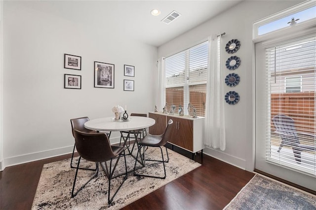 dining room with dark hardwood / wood-style floors