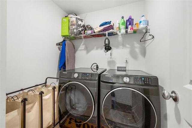 laundry area with washing machine and clothes dryer