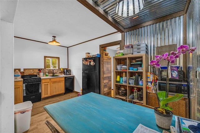 kitchen with light brown cabinetry, sink, black appliances, crown molding, and light wood-type flooring