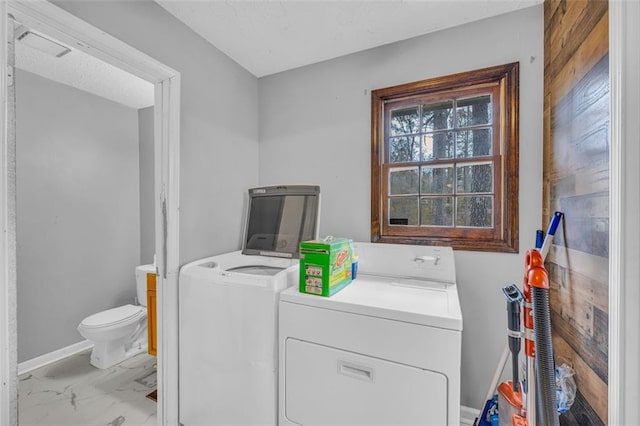 washroom featuring washer and clothes dryer