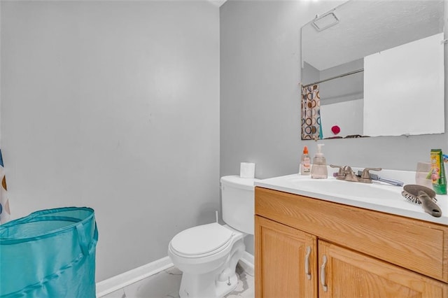 bathroom featuring vanity, toilet, and a shower with shower curtain