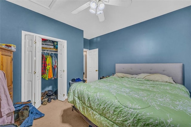 carpeted bedroom with ceiling fan and a closet