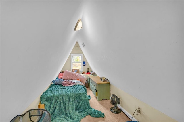 bedroom featuring carpet and lofted ceiling