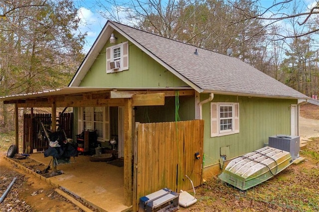 view of outbuilding with cooling unit and central AC unit