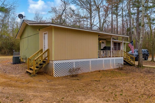 view of side of property featuring a porch