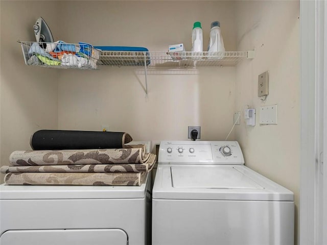 washroom with washer and clothes dryer