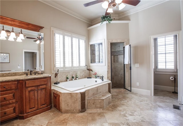 bathroom featuring tile flooring, large vanity, and a healthy amount of sunlight