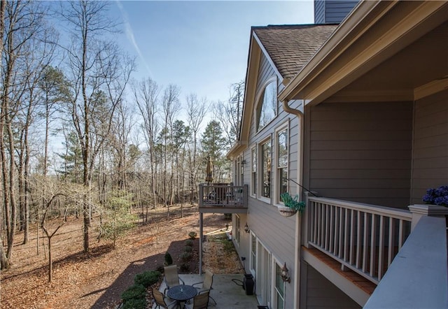 view of side of property with a wooden deck