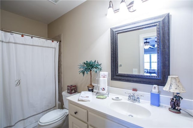 bathroom with toilet and vanity