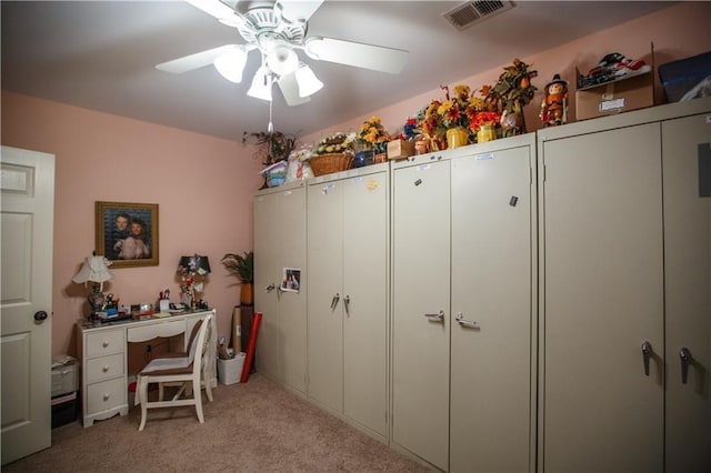 interior space with ceiling fan