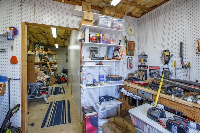 interior space featuring a workshop area and concrete floors