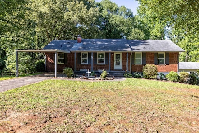 4370 Tradition Ter, Austell, GA 30106 - ranch-style house with driveway, brick siding, a front lawn, a carport, and a porch