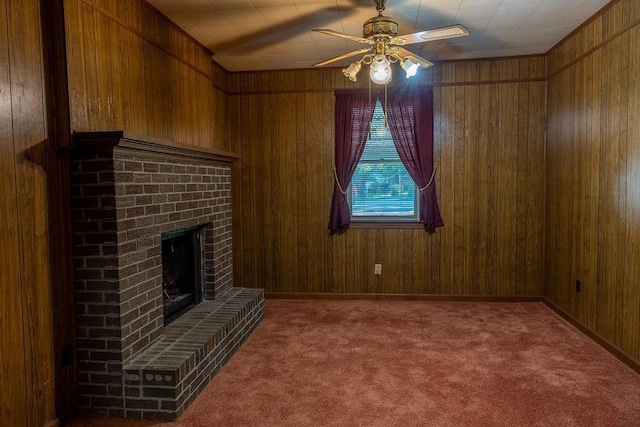 4370 Tradition Ter, Austell, GA 30106 - unfurnished living room featuring ceiling fan, wood walls, carpet, and a brick fireplace