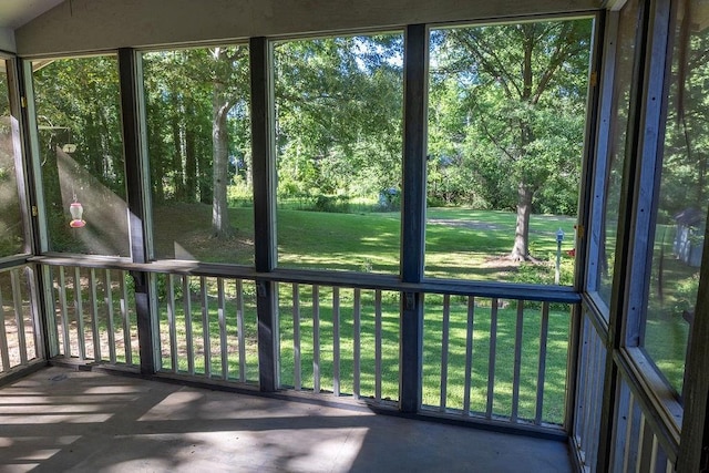 4370 Tradition Ter, Austell, GA 30106 - unfurnished sunroom featuring view of scattered trees and healthy amount of natural light