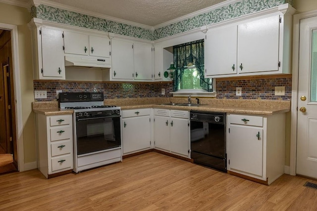 4370 Tradition Ter, Austell, GA 30106 - kitchen featuring dishwasher, range with gas stovetop, under cabinet range hood, light wood-style flooring, and white cabinets