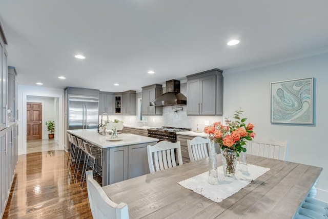 6144 Scott Dr, Flowery Branch, GA 30542 - dining area featuring wood finished floors, recessed lighting, and crown molding
