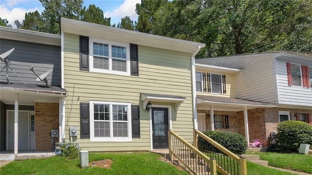6964 Oakhill Cir, Austell, GA 30168 - townhome / multi-family property featuring brick siding and a front lawn
