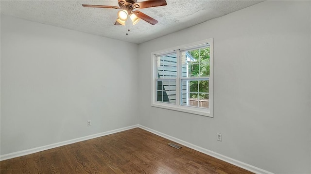 6964 Oakhill Cir, Austell, GA 30168 - empty room featuring a textured ceiling, baseboards, dark wood finished floors, and a ceiling fan