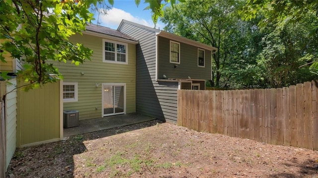 6964 Oakhill Cir, Austell, GA 30168 - back of house featuring fence, central AC, and a patio