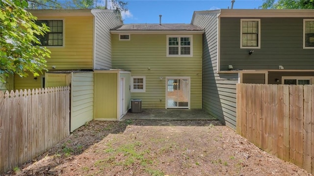 6964 Oakhill Cir, Austell, GA 30168 - back of house with central air condition unit and fence