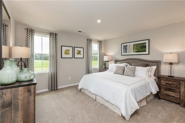 bedroom featuring light colored carpet