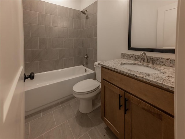 full bathroom with tile patterned floors, tiled shower / bath combo, toilet, and vanity