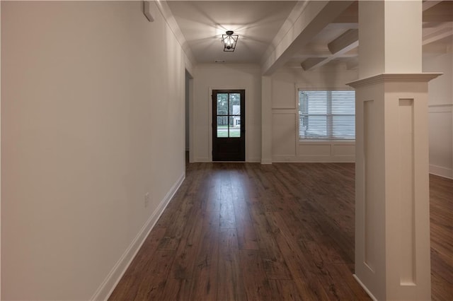 entryway with beamed ceiling and dark hardwood / wood-style floors