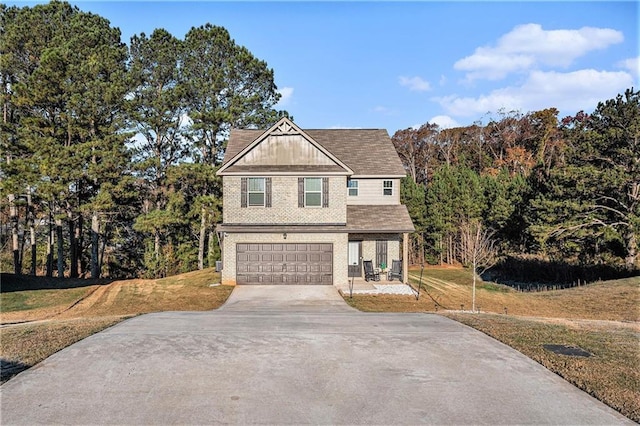 view of front facade with a front yard and a garage