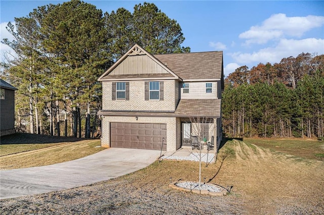 view of front of home with a garage and a front yard