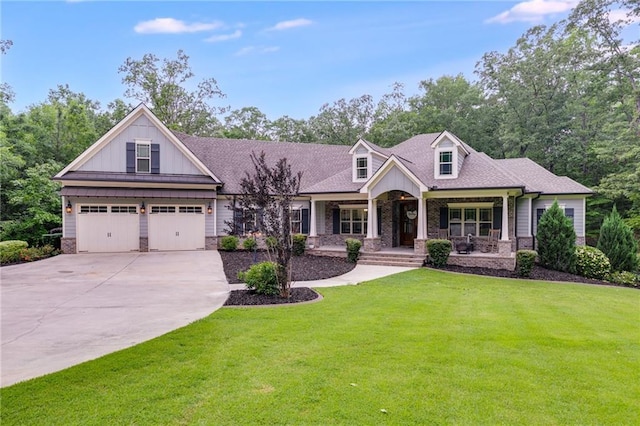 7269 Tyree Rd, Winston, GA 30187 - view of front facade with a porch, concrete driveway, a front lawn, board and batten siding, and an attached garage
