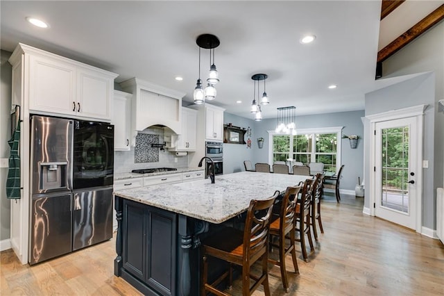 7269 Tyree Rd, Winston, GA 30187 - kitchen with stainless steel appliances, white cabinets, decorative backsplash, light stone counters, and recessed lighting