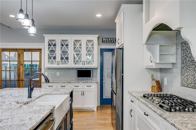 7269 Tyree Rd, Winston, GA 30187 - kitchen with stainless steel appliances, white cabinets, hanging light fixtures, decorative backsplash, and recessed lighting