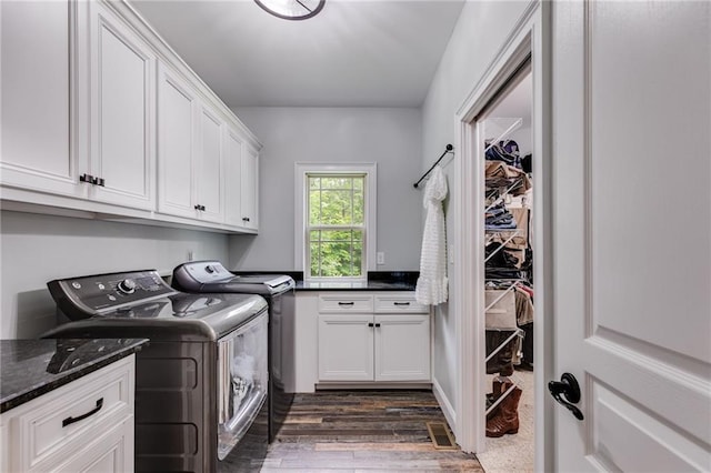 7269 Tyree Rd, Winston, GA 30187 - washroom with cabinet space, independent washer and dryer, and dark wood-type flooring