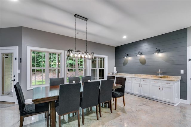 7269 Tyree Rd, Winston, GA 30187 - dining room featuring concrete floors, wood walls, and recessed lighting