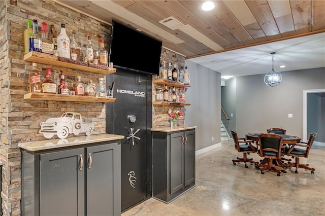 7269 Tyree Rd, Winston, GA 30187 - indoor dry bar with finished concrete flooring, stairs, recessed lighting, wood ceiling, and hanging light fixtures