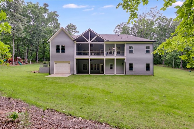 7269 Tyree Rd, Winston, GA 30187 - back of property with a yard, a garage, a sunroom, and a patio