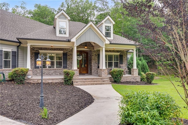 7269 Tyree Rd, Winston, GA 30187 - view of front of home with a porch, brick siding, and roof with shingles