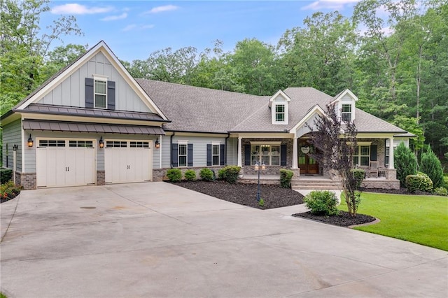 7269 Tyree Rd, Winston, GA 30187 - view of front of property featuring a porch, concrete driveway, board and batten siding, a front lawn, and a shingled roof