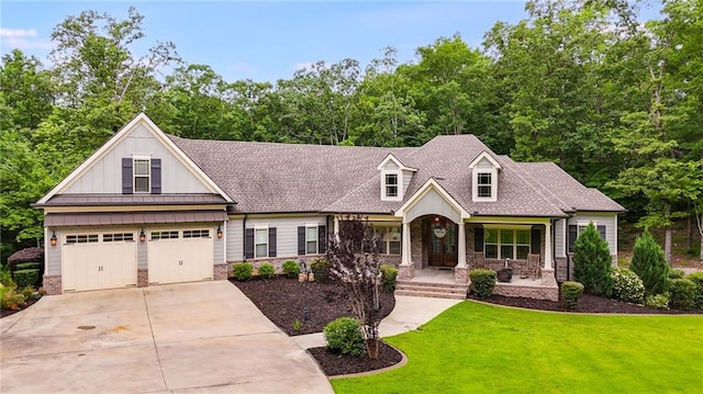 7269 Tyree Rd, Winston, GA 30187 - view of front of home featuring driveway, a front yard, board and batten siding, a standing seam roof, and a garage
