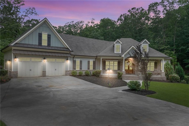 7269 Tyree Rd, Winston, GA 30187 - view of front of house with driveway, board and batten siding, a porch, an attached garage, and roof with shingles
