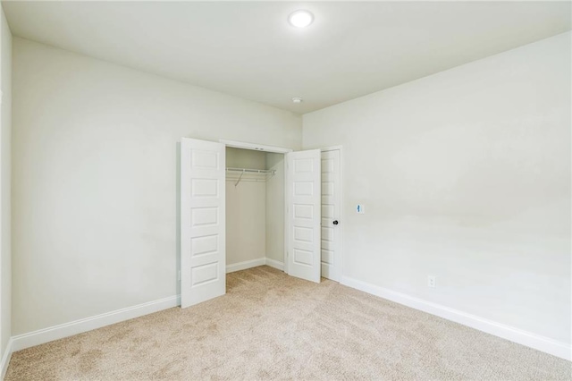 623 Hamilton E Holmes Dr NW, Atlanta, GA 30318 - unfurnished bedroom featuring light colored carpet, a closet, and recessed lighting